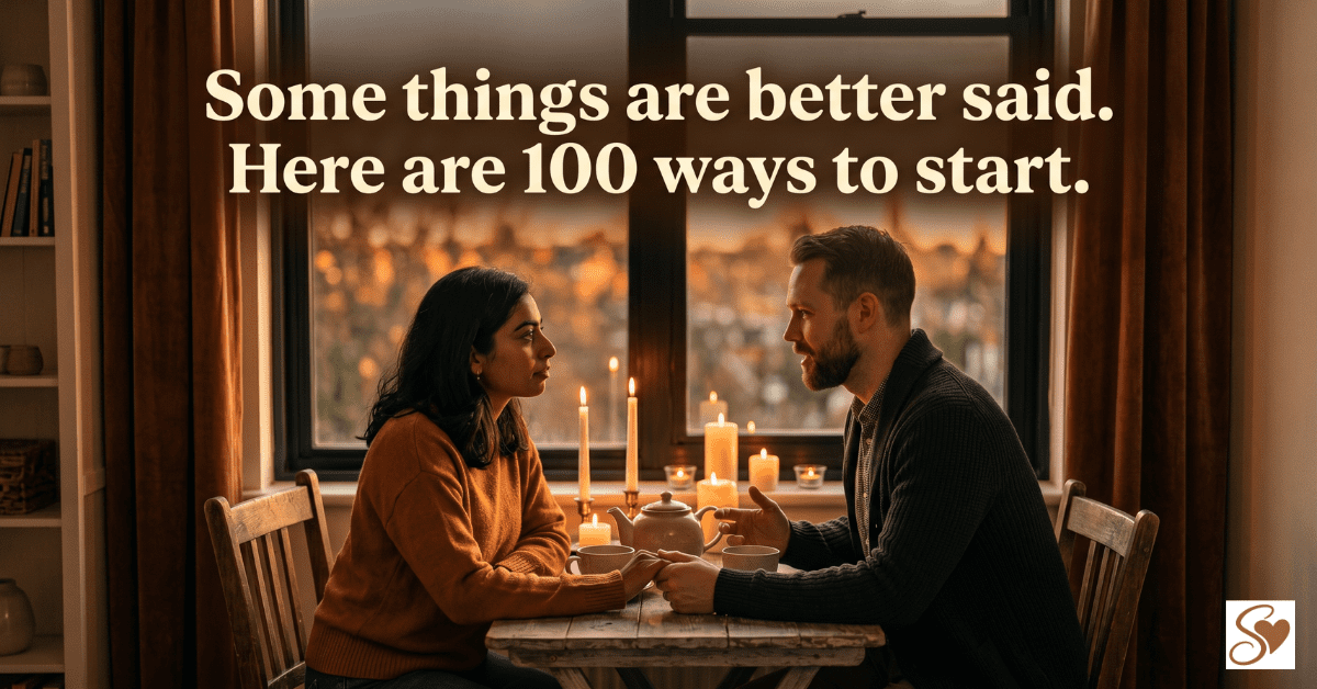 Romantic couple talking at candlelight table sharing meaningful things to say to your partner in a warm cozy setting.